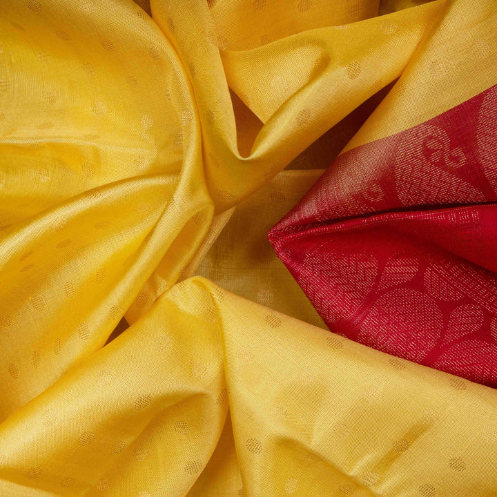 Closeup of Handwoven Yellow with dual toned reddis pink silk Saree