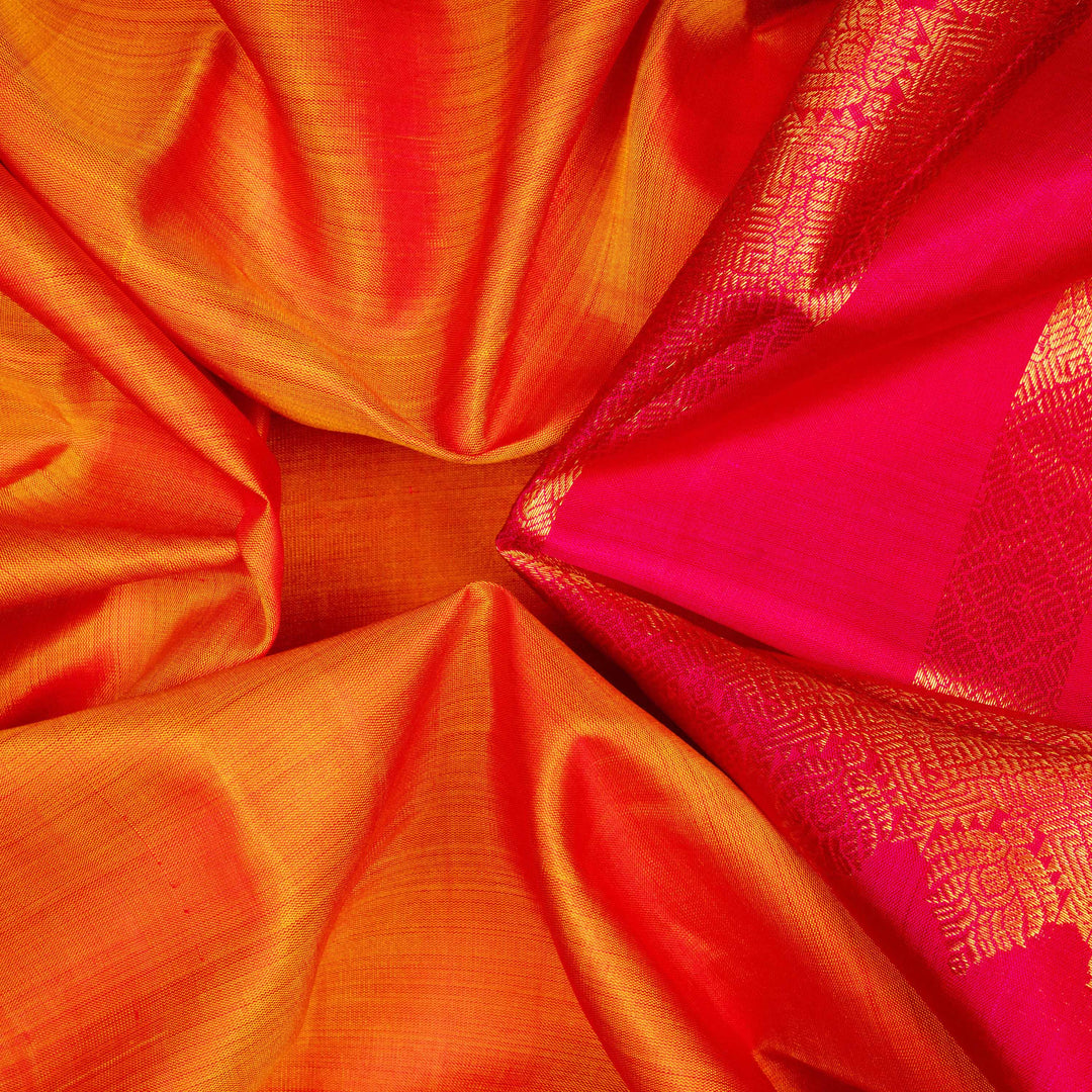 Closeup of Handwoven Orange with pink Kanjivaram silk Saree