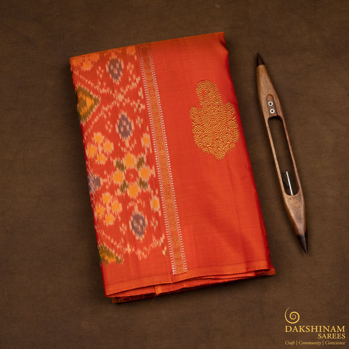 Folded Handwoven Orange borderless Ikat Kanjivaram silk Saree