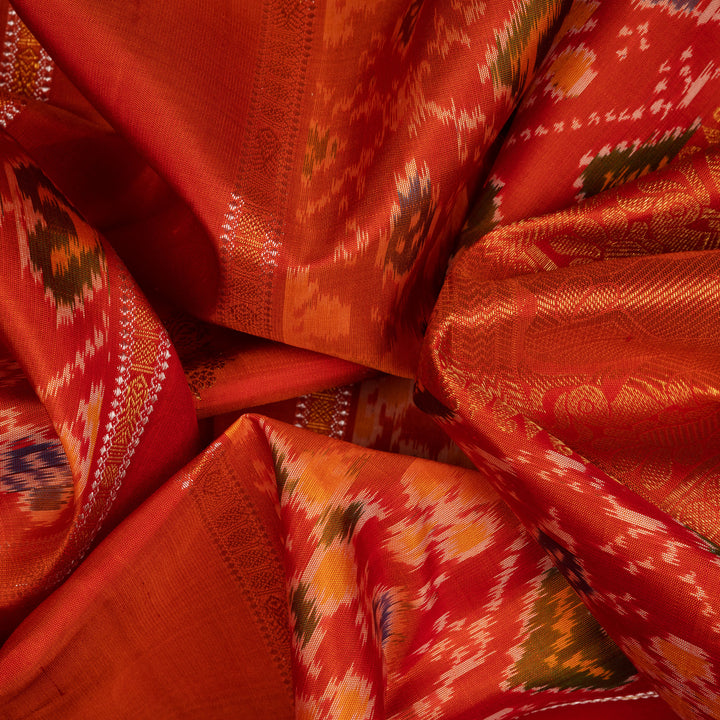 Clouseup of Handwoven Orange borderless Ikat Kanjivaram silk Saree