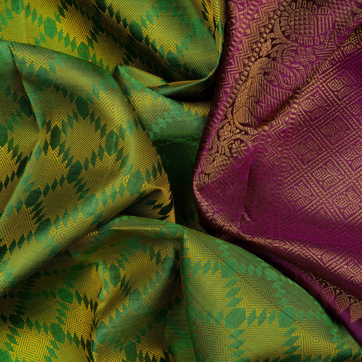 Closeup view of a Light green Kanjivaram silk saree with temple border and purple pallu.