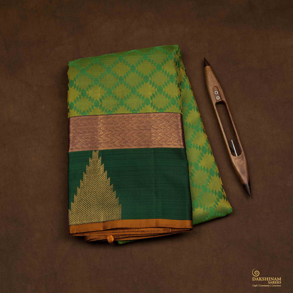 Body view of a Light green Kanjivaram silk saree with temple border and purple pallu.