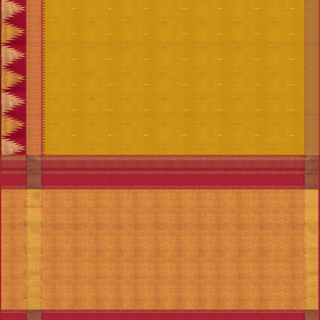 Body pallu Closeup of a Yellow Korvai Kanjivaram silk saree with red temple border.