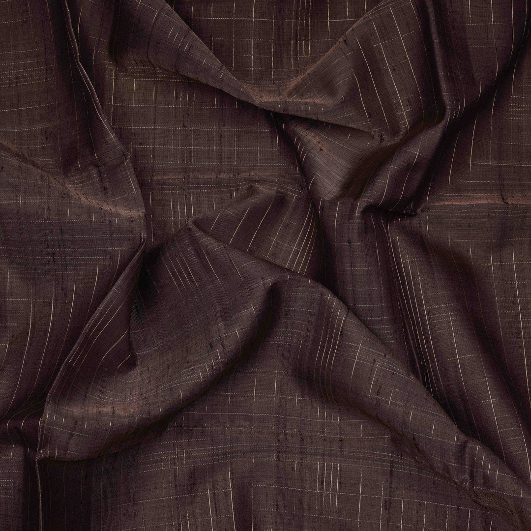 Close-up of brown fabric with subtle pattern