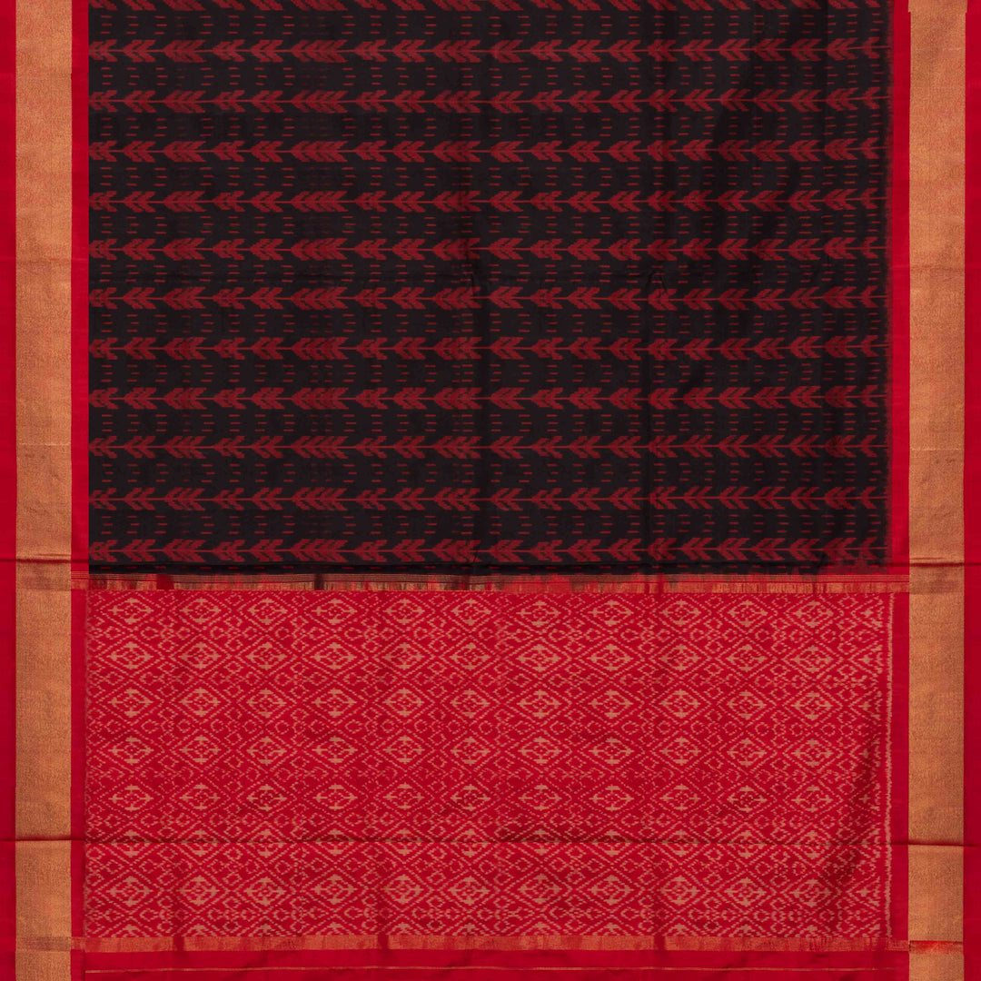 Closeup view of a Black Ikat silk saree with red border and floral diamond pallu.