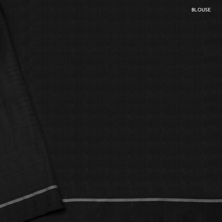Blouse closeup of a Black double Ikat saree with striped body.