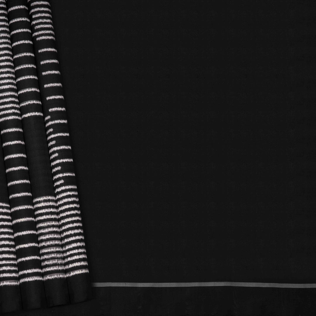 Full view of a Black double Ikat saree with striped body.