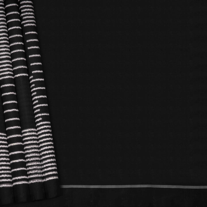 Full view of a Black double Ikat saree with striped body.