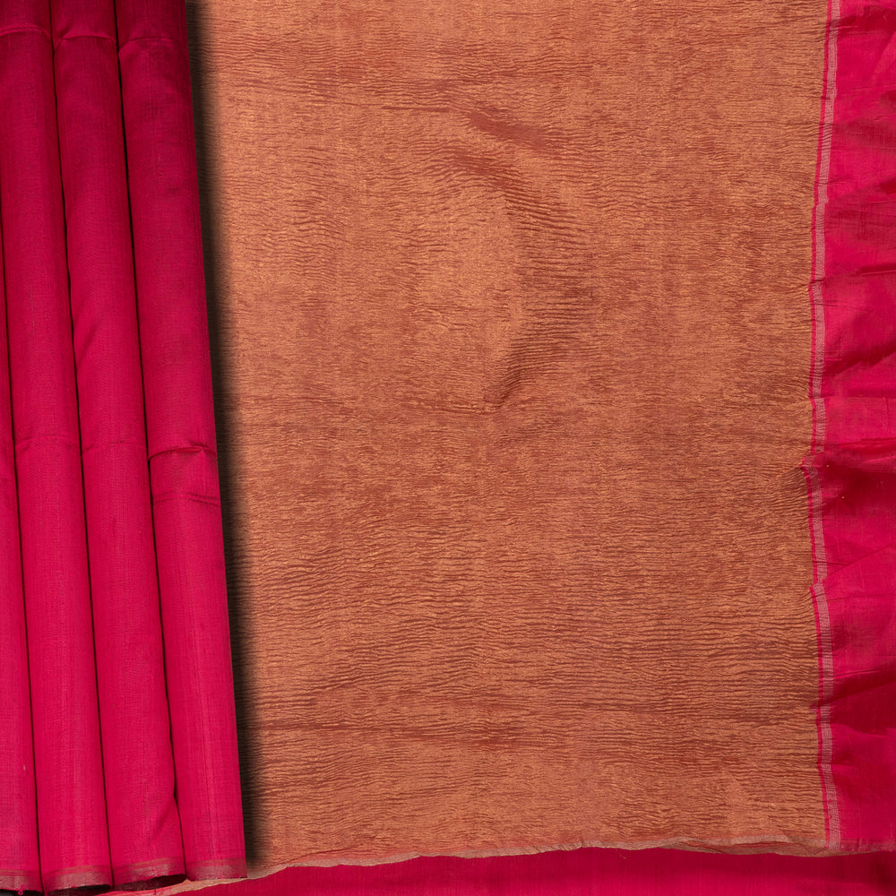 Closeup view of a Peach Dupion silk saree with crushed gold tissue pallu.
