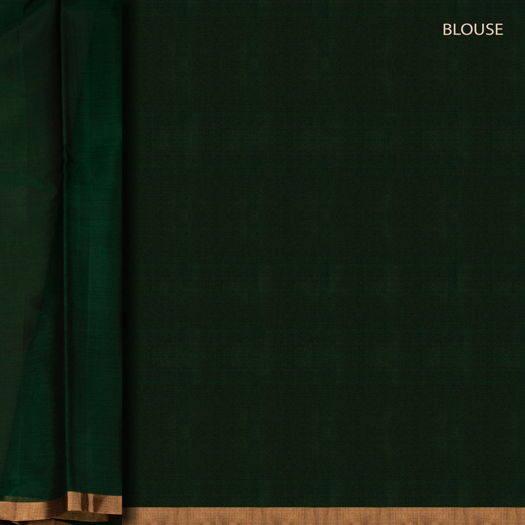 Blouse closeup of a Multicolor silk cotton saree with green pallu and gold zari florals.