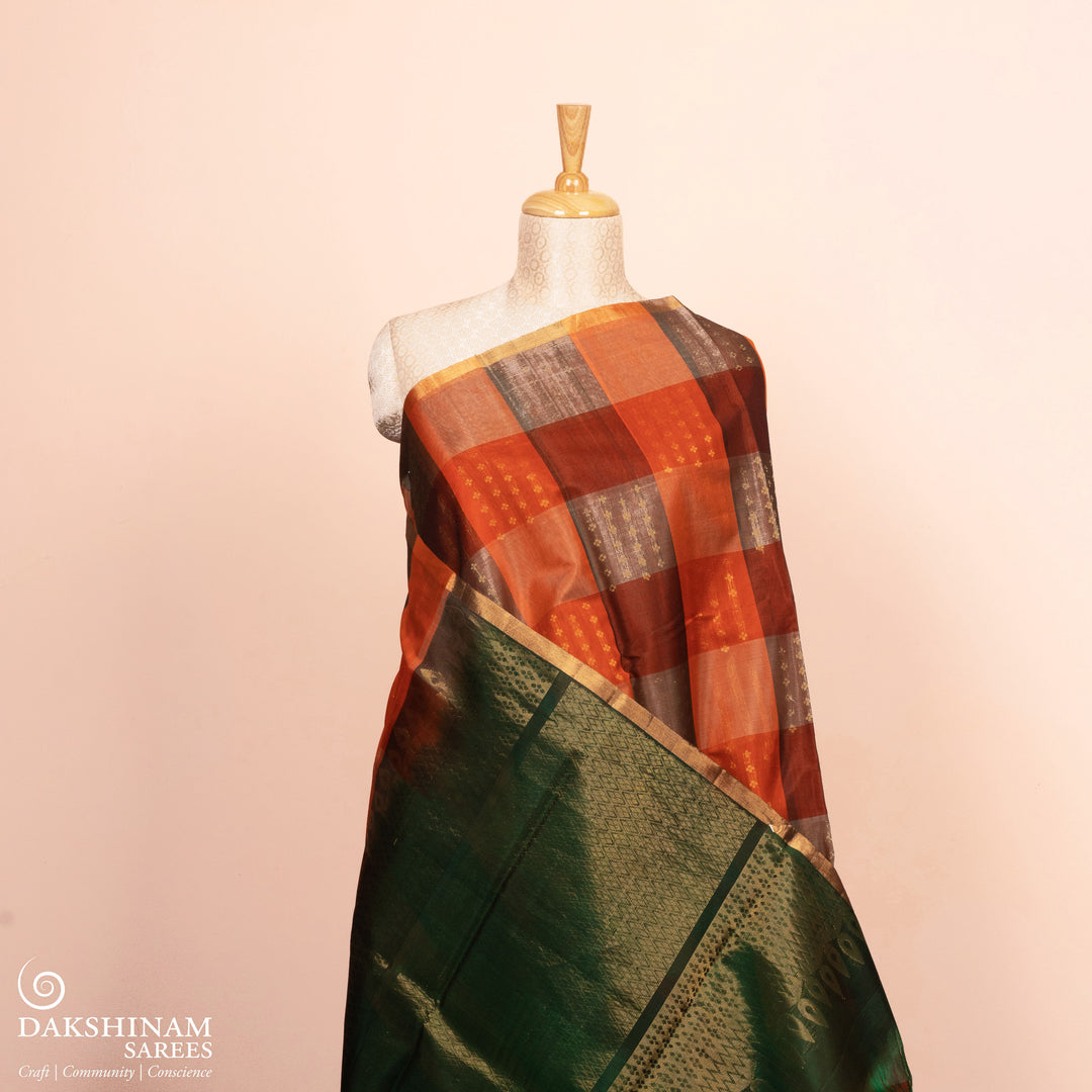 Full view of a Multicolor silk cotton saree with green pallu and gold zari florals.