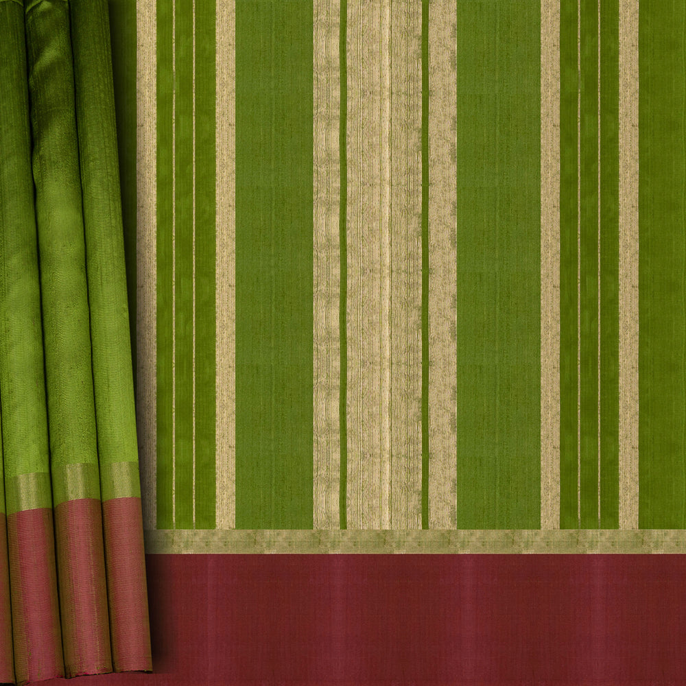 Closeup of a Green Dupion silk saree with pink border and gold zari pallu.