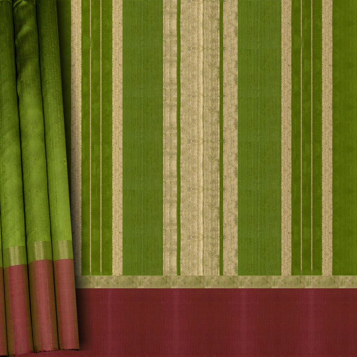 Closeup of a Green Dupion silk saree with pink border and gold zari pallu.
