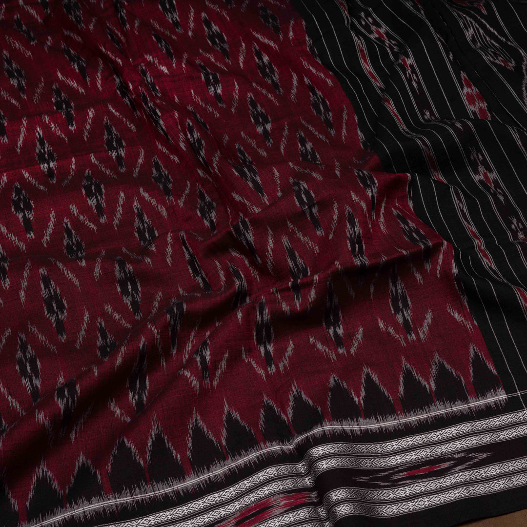 Closeup of Handwoven maroon with black Ikat Cotton Saree