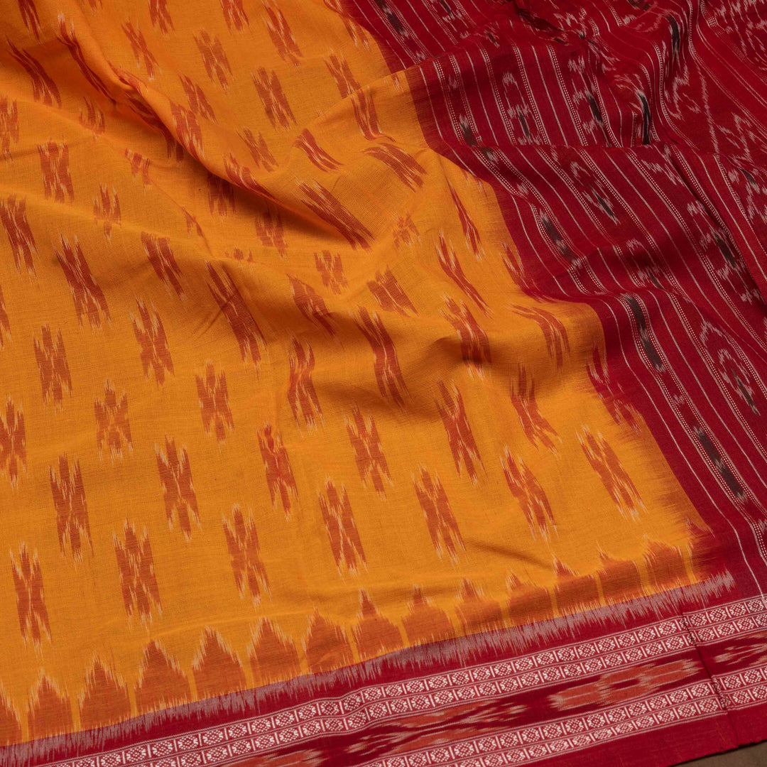 Closeup of Handwoven light orange with maroon Ikat Cotton Saree