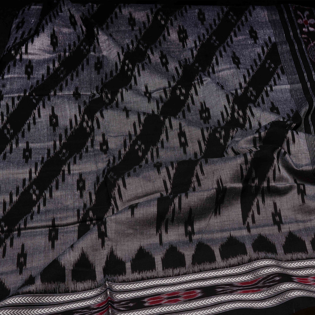 Closeup of Handwoven grey with black Ikat Cotton Saree