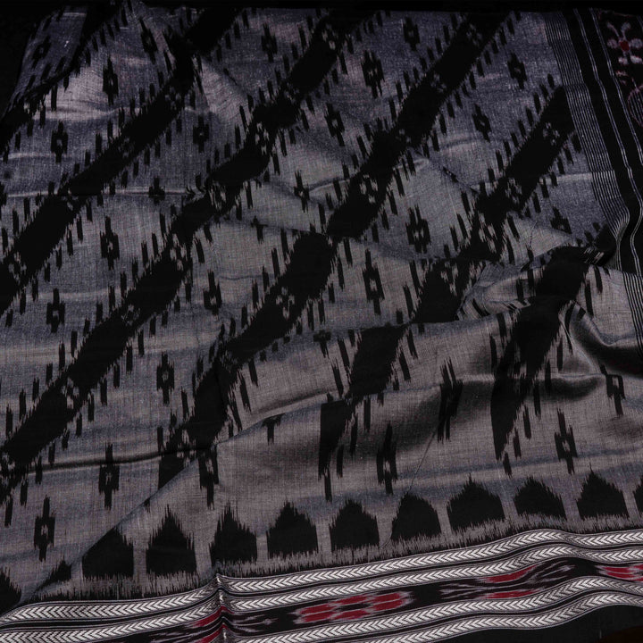 Closeup of Handwoven grey with black Ikat Cotton Saree