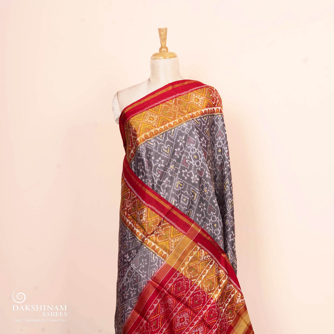 Pleats/body of Handwoven grey and red Ikat silk Saree