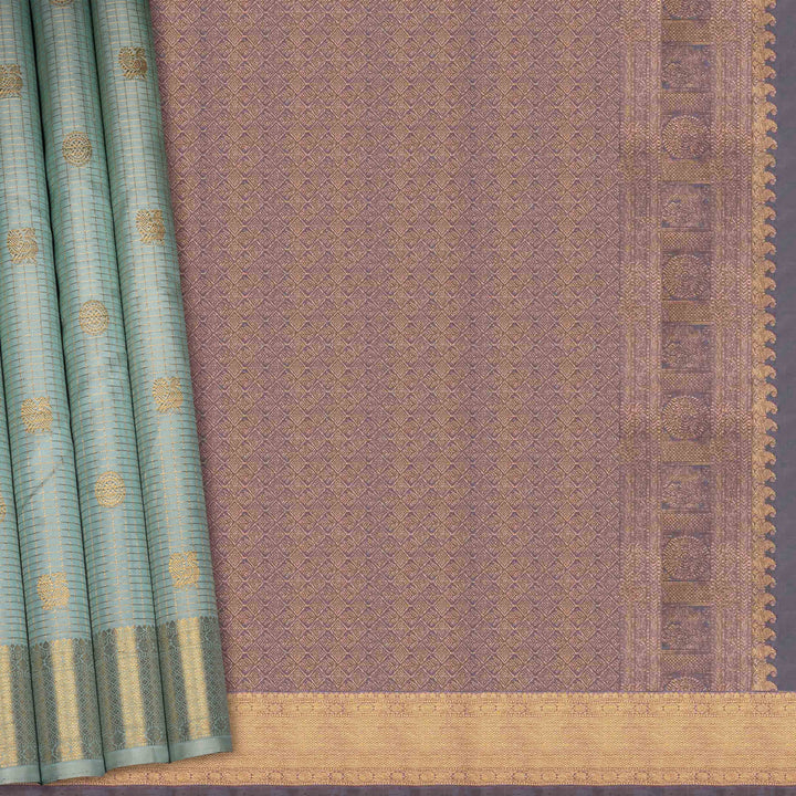 Textured fabric with a green border and gold pattern on a gray background
