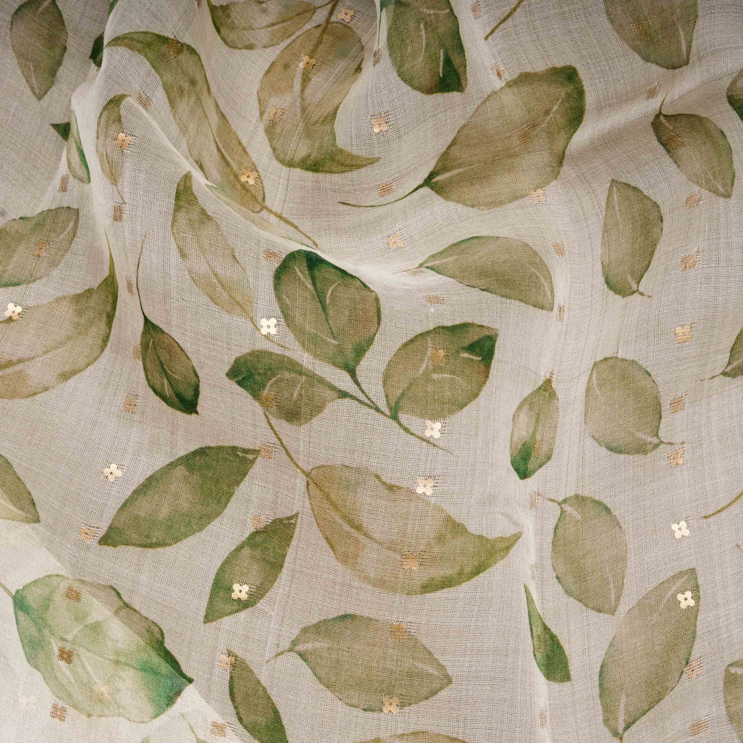 Fabric with green leaf pattern on a beige background