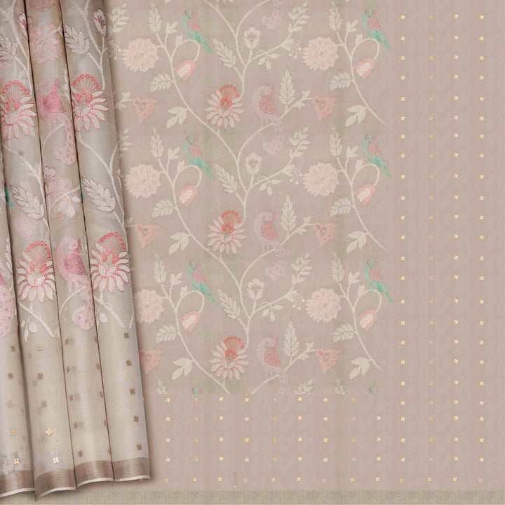 Floral and bird patterned fabric with a soft color palette on a neutral background
