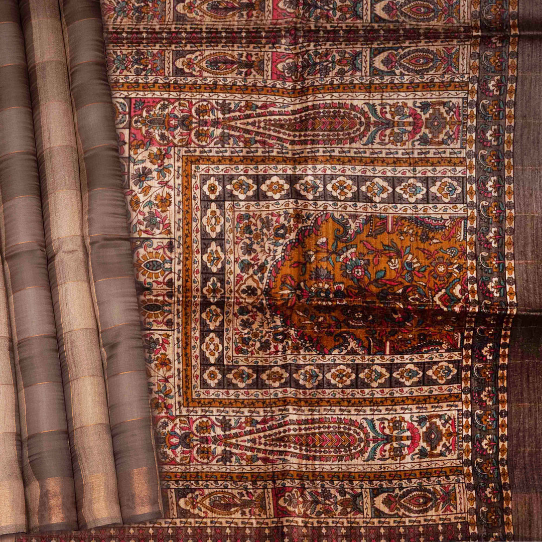 Decorative fabric with intricate patterns and an elephant design.