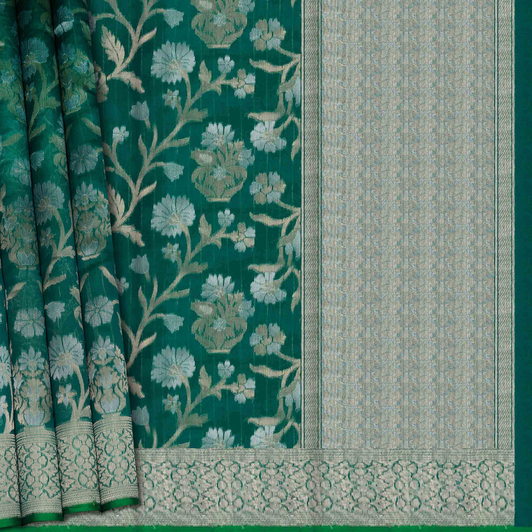 Green fabric with floral patterns and a geometric border
