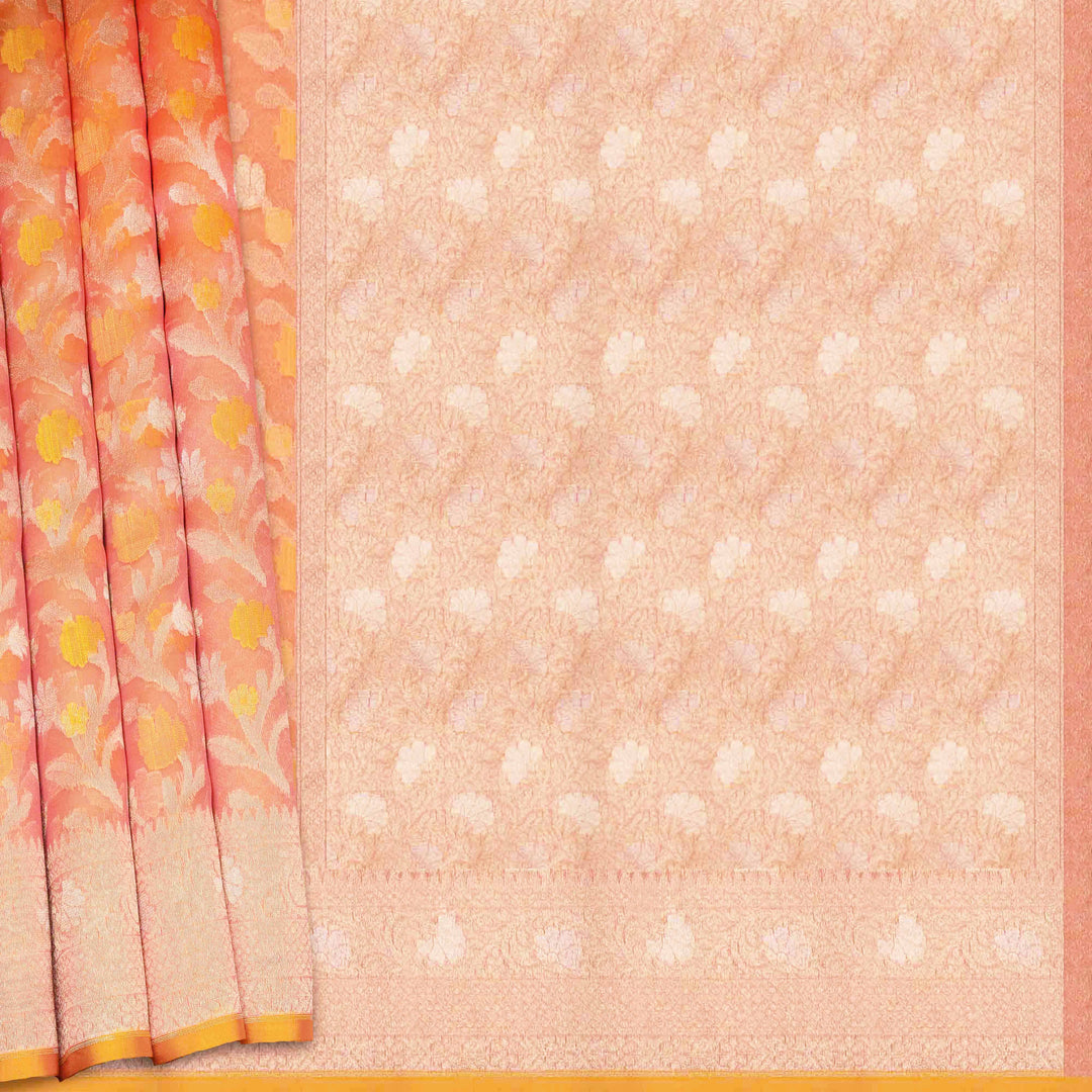 Saree with floral border and white dot pattern on peach background