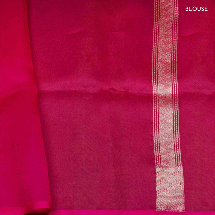 Pink blouse with a decorative white border on a matching pink background