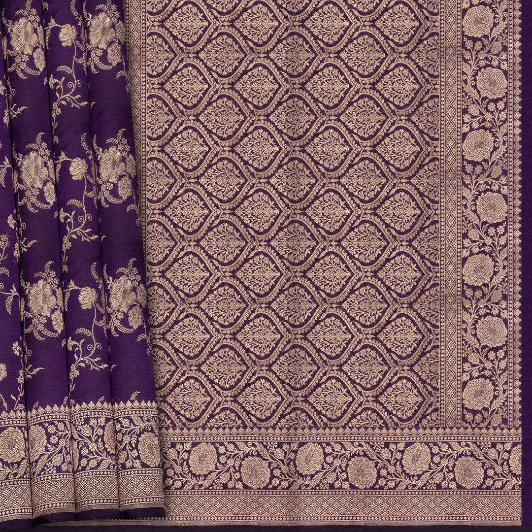 Purple fabric with intricate white floral and geometric patterns