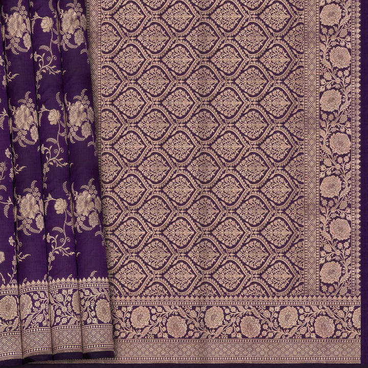 Purple fabric with intricate white floral and geometric patterns