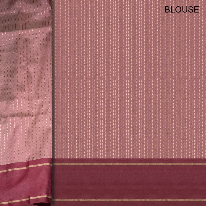 Maroon and gold traditional blouse fabric with a subtle pattern