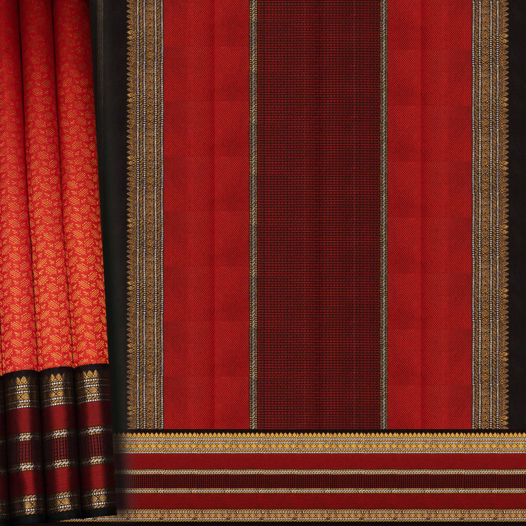 Red fabric with gold and black patterns on a dark background