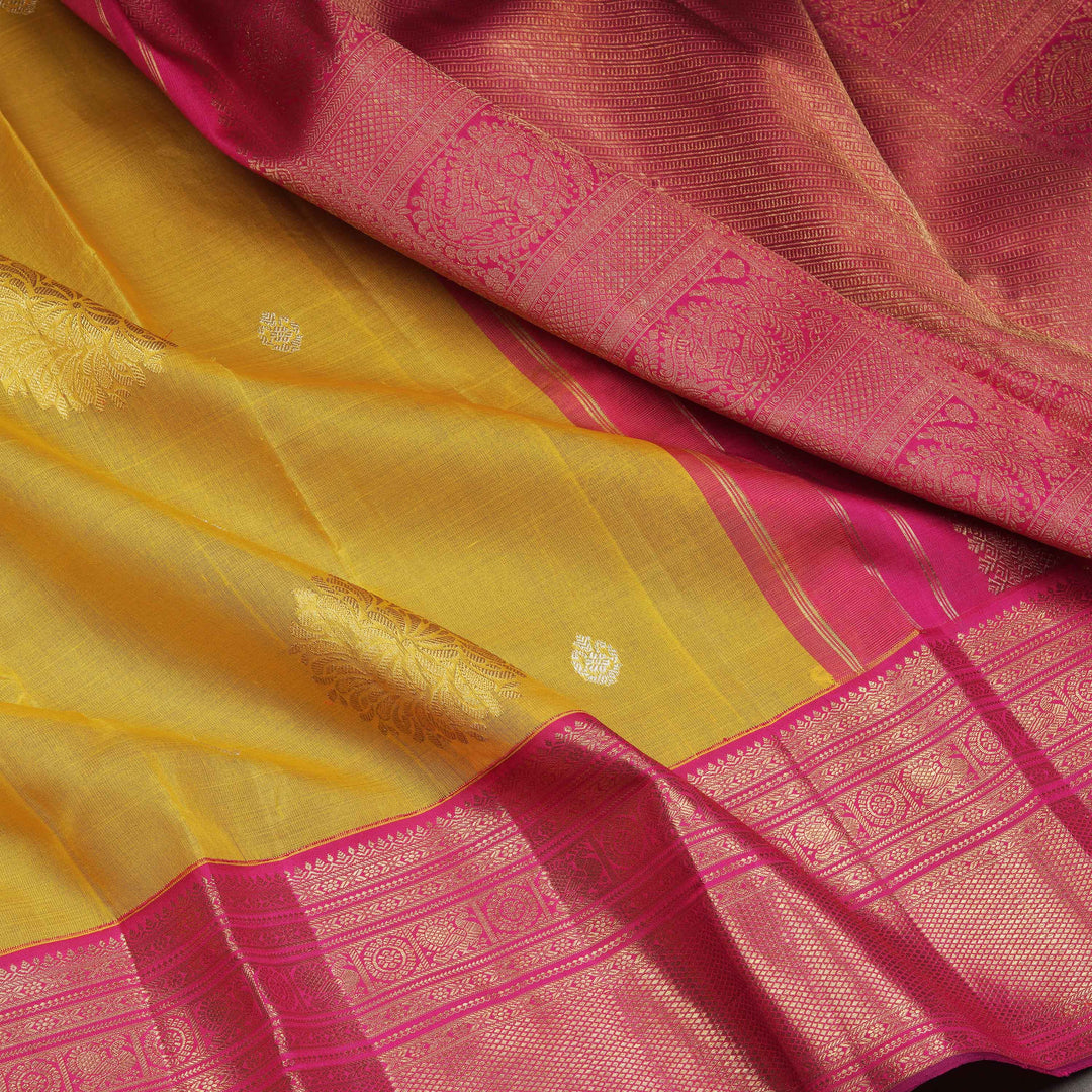 Pink and yellow saree with intricate patterns