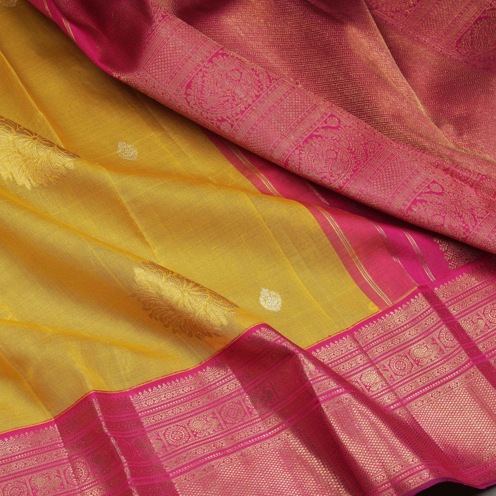 Pink and yellow saree with intricate patterns