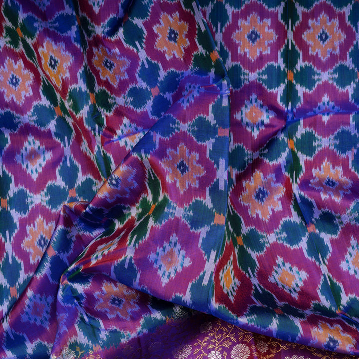 Closeup of Handwoven Ikat Kanjivaram silk saree in purple color