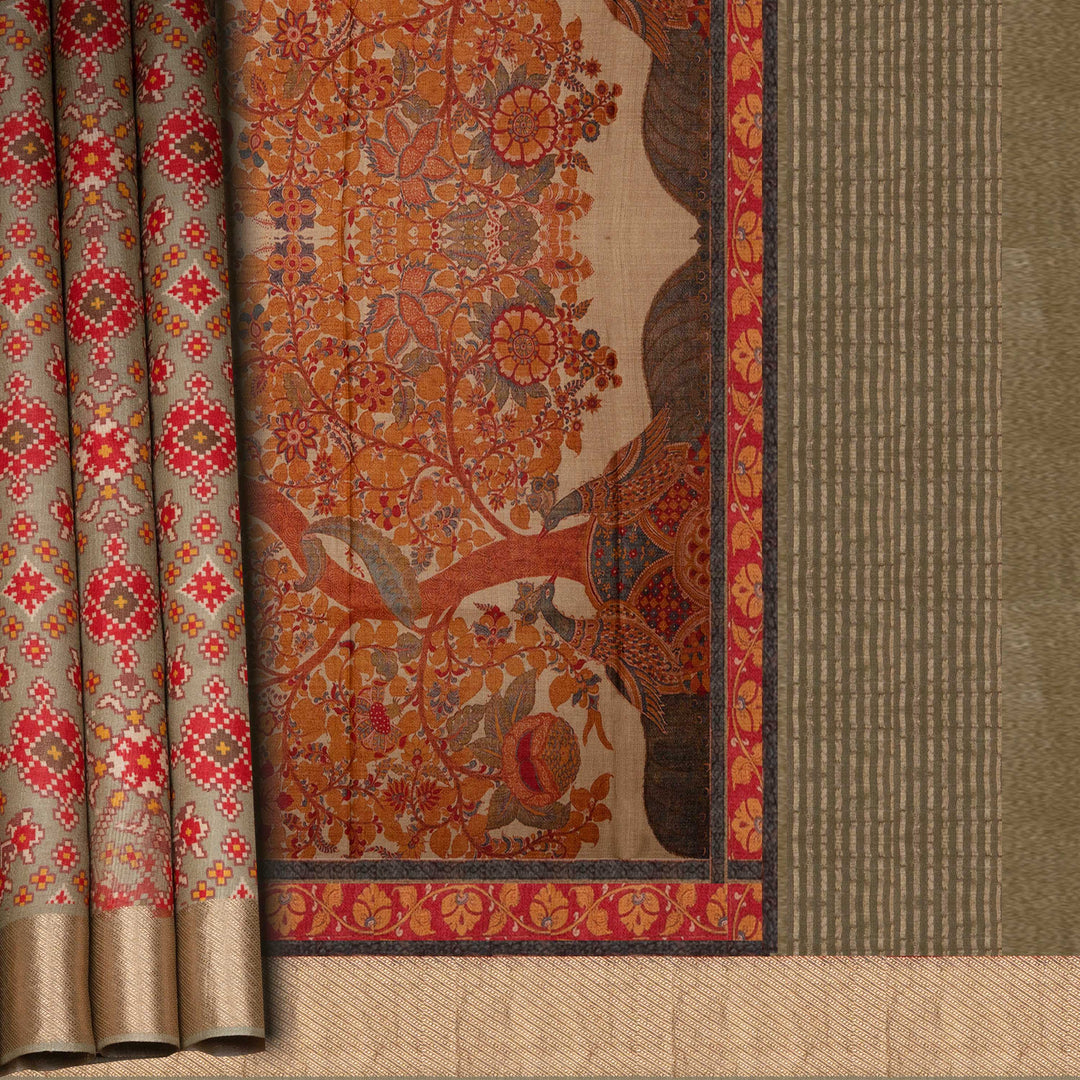 Decorative fabric with intricate patterns in red, orange, and beige on a textured background.