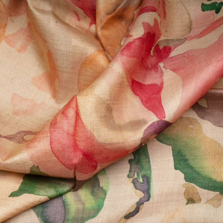 Close-up of floral fabric with red, green, and beige colors.