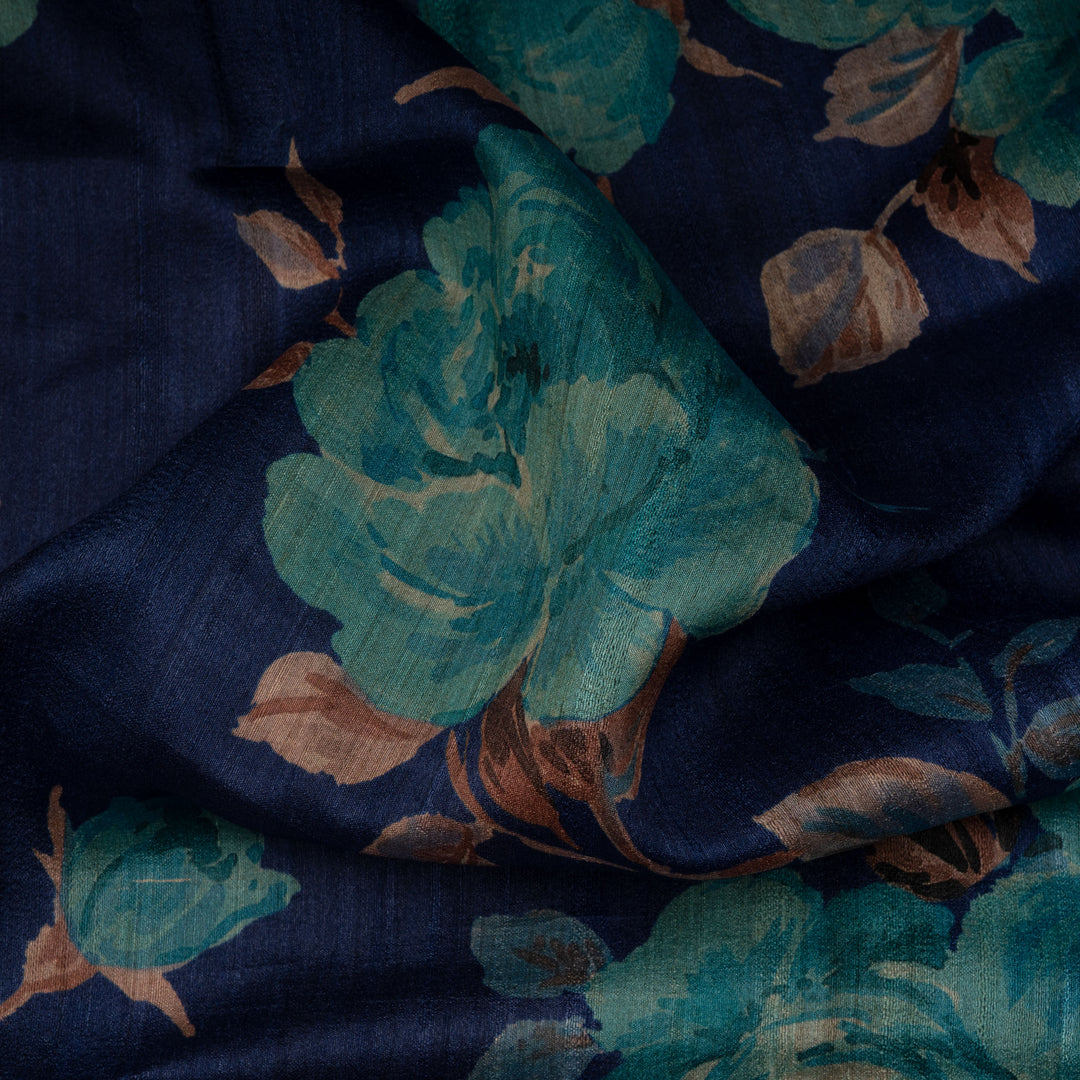 Navy blue fabric with teal floral patterns