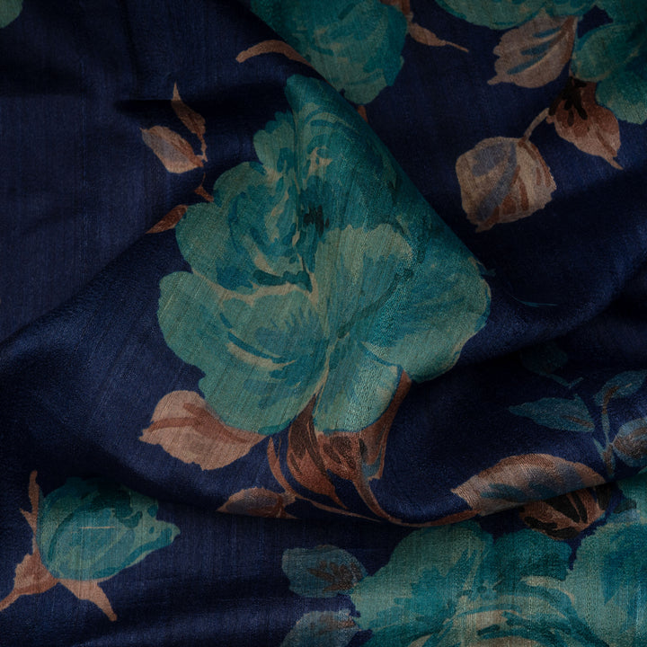 Navy blue fabric with teal floral patterns