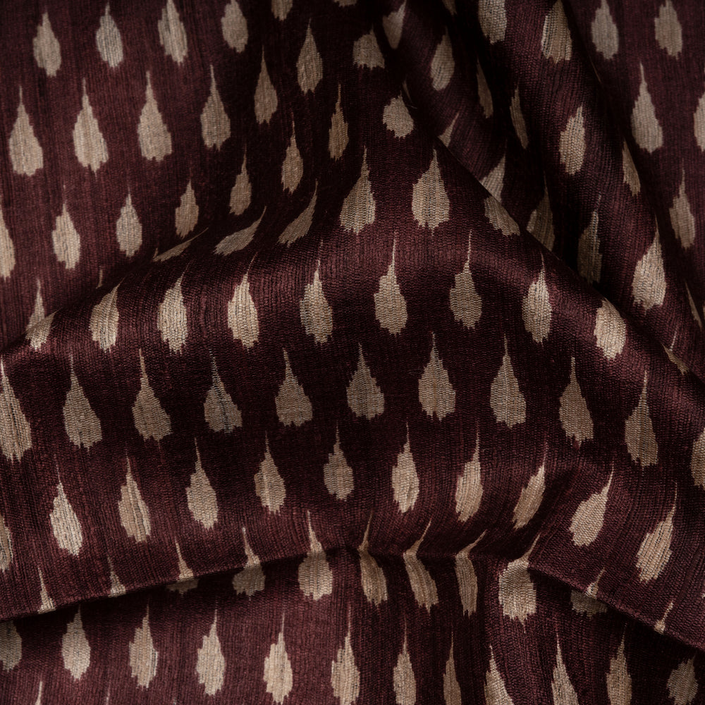 Close-up of brown fabric with white feather pattern
