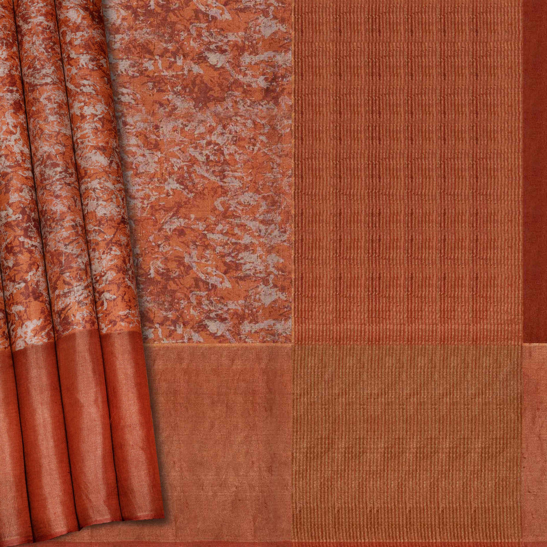 Close-up of a fabric with a textured pattern in shades of brown and orange.