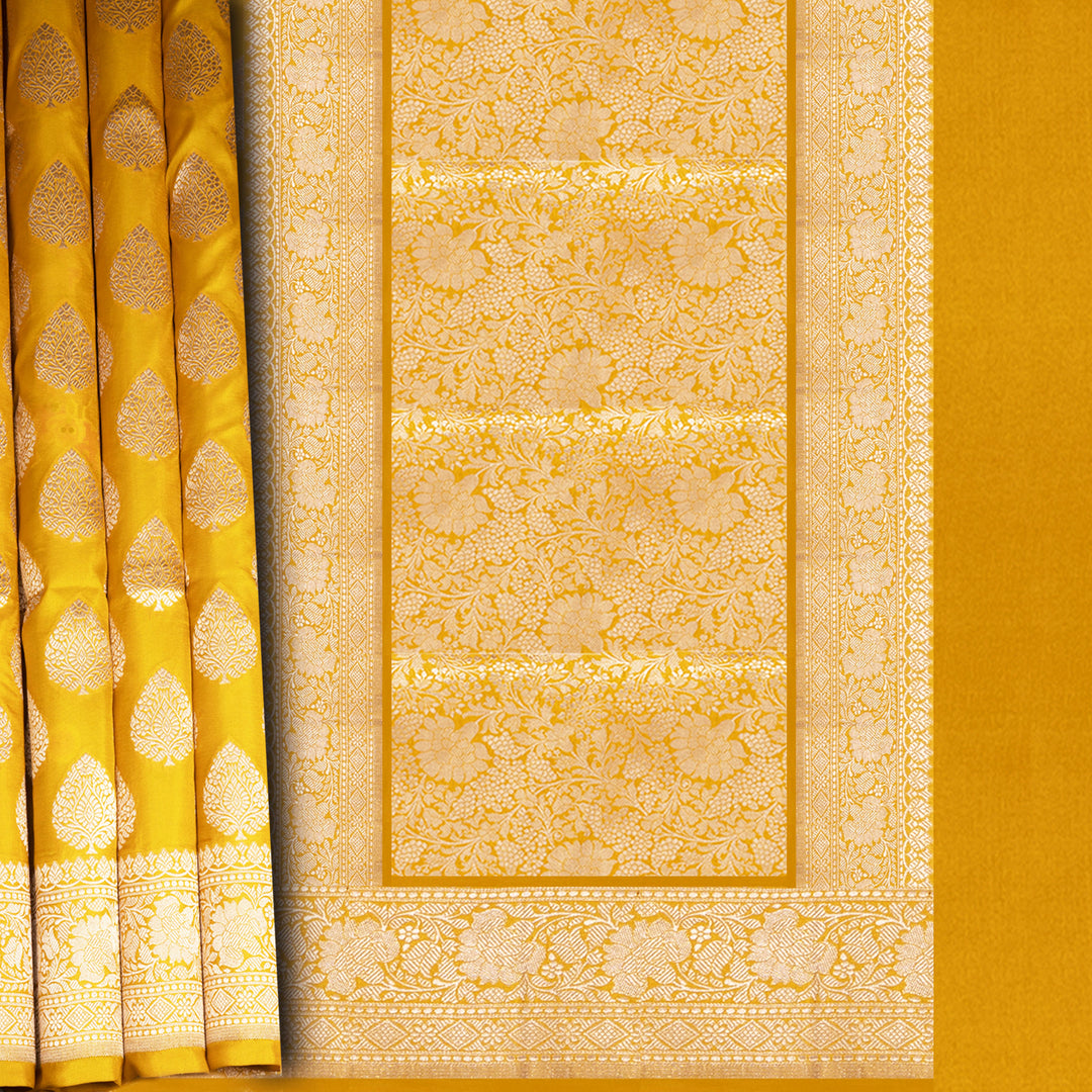 Close-up of a yellow fabric with intricate patterns and designs.