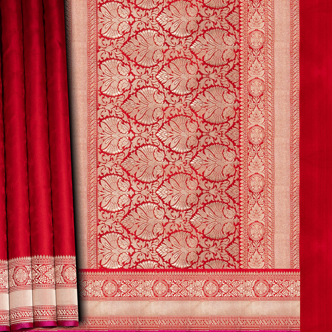 Red and gold patterned fabric with intricate design