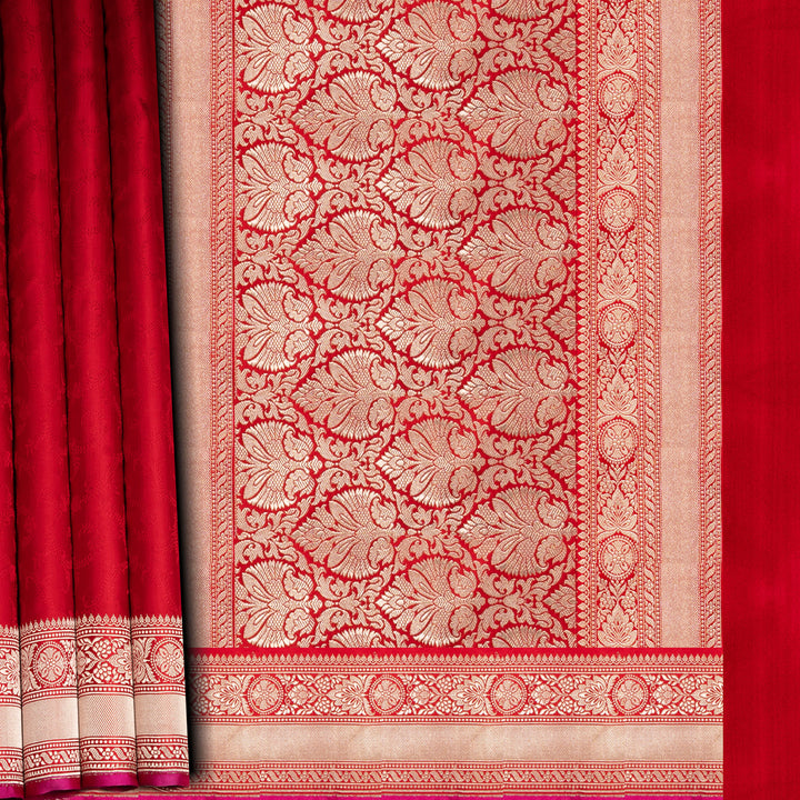 Red and gold patterned fabric with intricate design