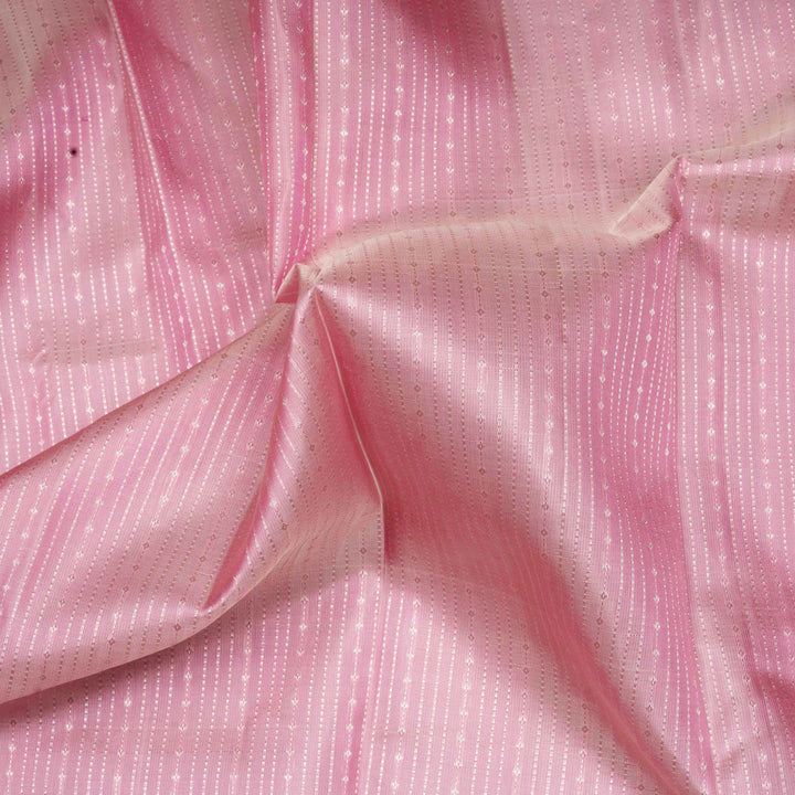 Close-up of pink fabric with a subtle pattern