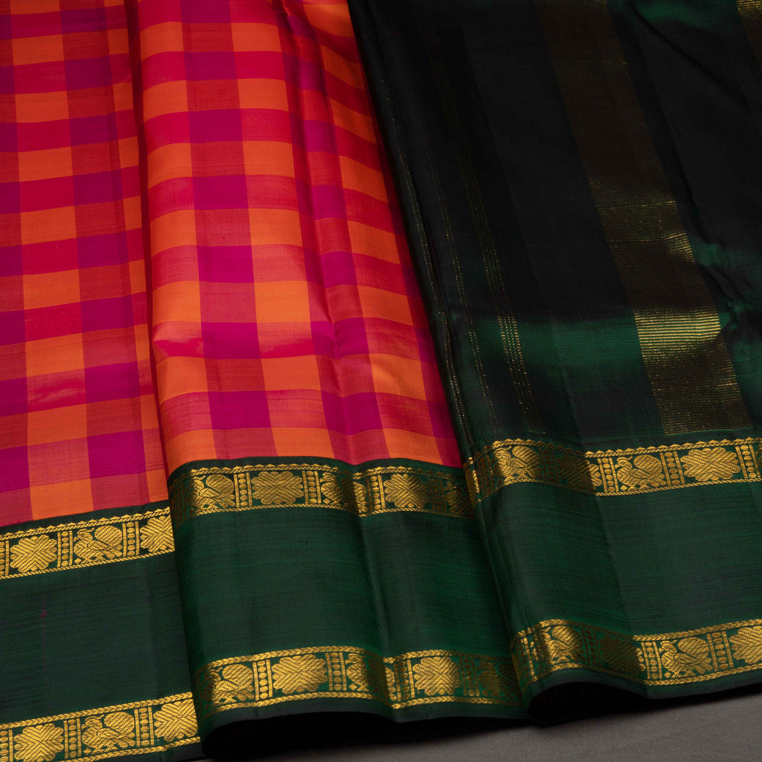 Saree with a checkered pattern in red and green with gold border