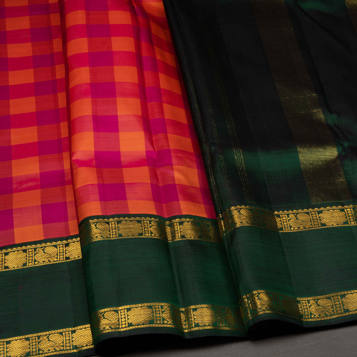 Saree with a checkered pattern in red and green with gold border