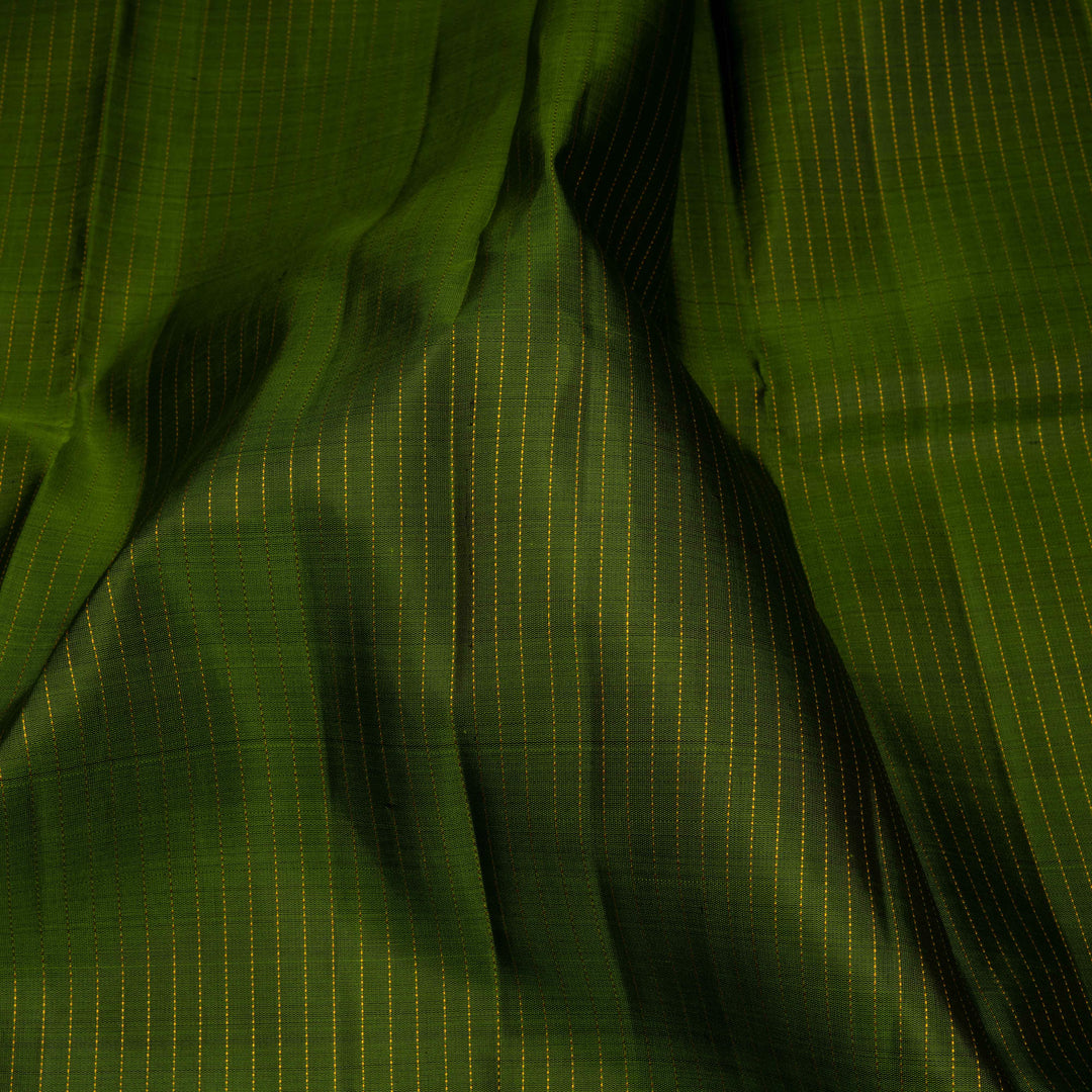 Close-up of green fabric with subtle pattern