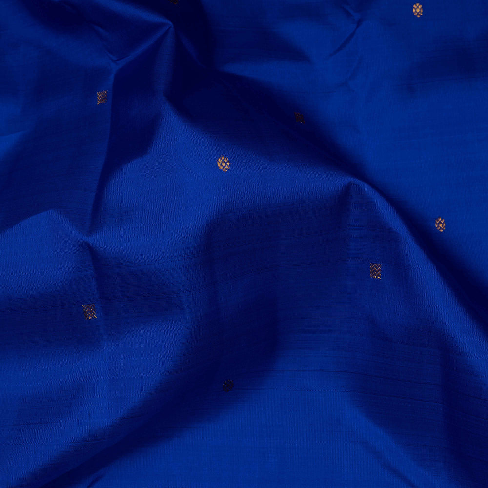 Close-up of blue fabric with small gold patterns